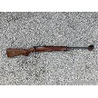 Full profile view of an Australian Sportco Omark Model 44 single-shot bolt-action target rifle with wooden stock 