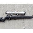 Savage 93R17 stainless bolt action rifle with black synthetic stock and Nikon Pro Staff 3-9x40 scope 