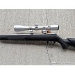 Savage 93R17 stainless bolt action rifle with black synthetic stock and Nikon Pro Staff 3-9x40 scope 