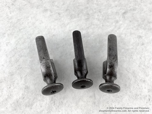 Russian Mosin-Nagant bolt cocking piece showing the stamped Izhevsk Triangle factory marking. 