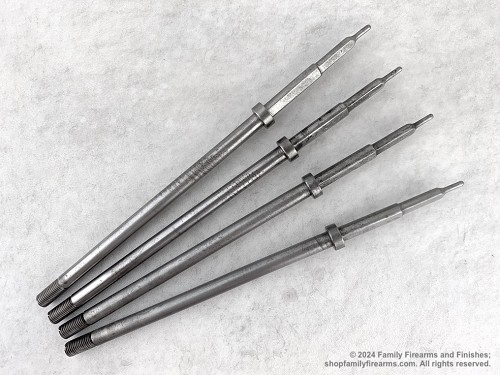 Full-length view of an original steel Mosin-Nagant rifle bolt firing pin showing the threaded end. 