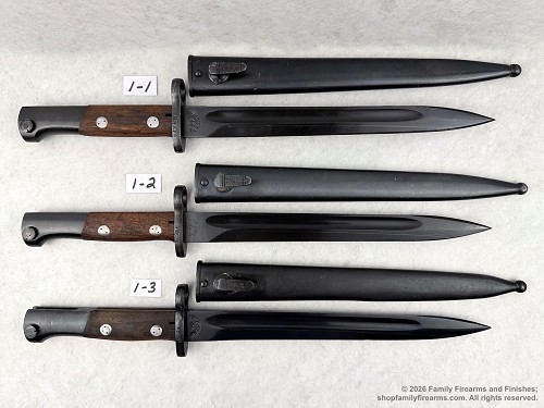 Original Yugoslavian M48 military surplus bayonets displayed next to its matching steel scabbard 