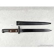 Original Yugoslavian M48 military surplus bayonet displayed next to its matching steel scabbard 